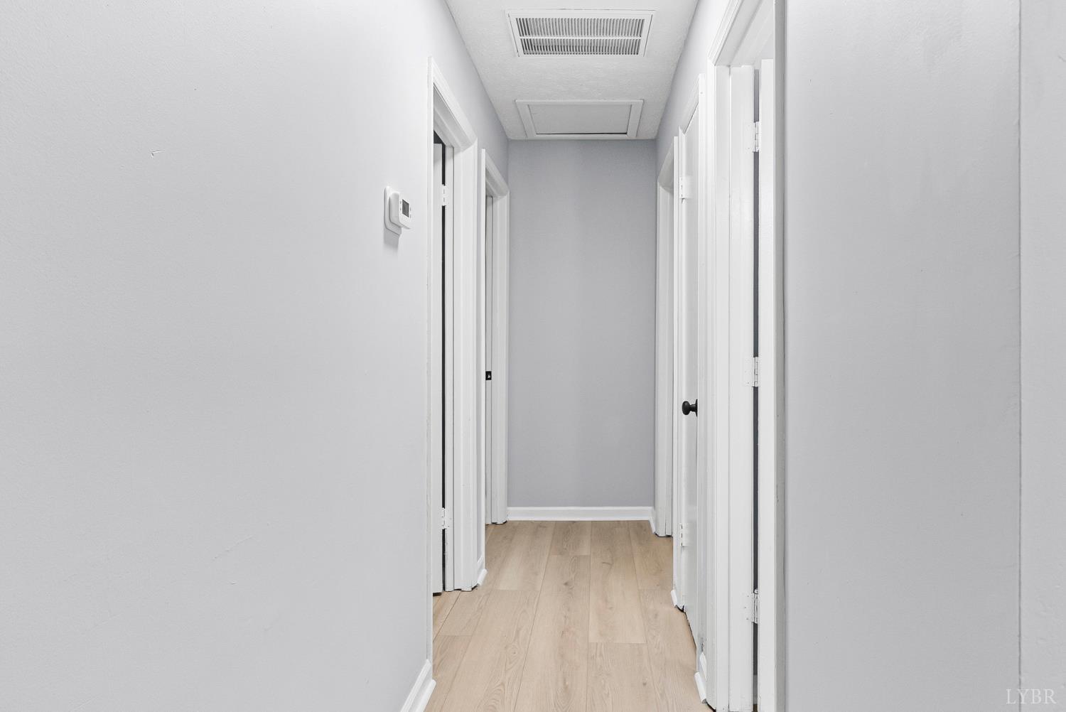1077 Ringgold Road Ringgold, VA 24586 - Photo 17 of 35 a view of hallway with closet and wooden floor