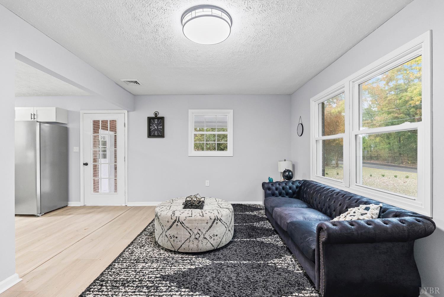 1077 Ringgold Road Ringgold, VA 24586 - Photo 22 of 35 a living room with furniture and a large window