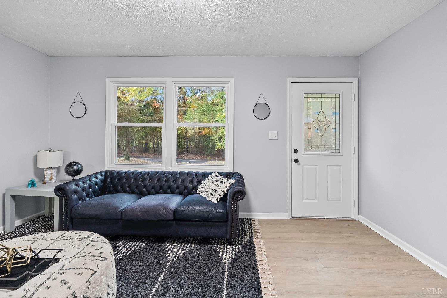 1077 Ringgold Road Ringgold, VA 24586 - Photo 26 of 35 a living room with furniture and a window