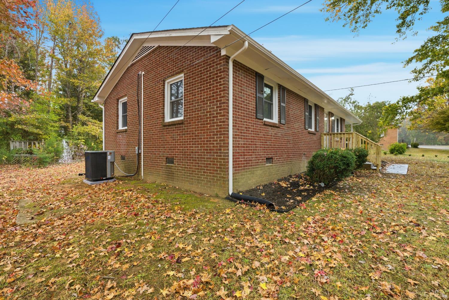 1077 Ringgold Road Ringgold, VA 24586 - Photo 3 of 35 a view of a house with a yard