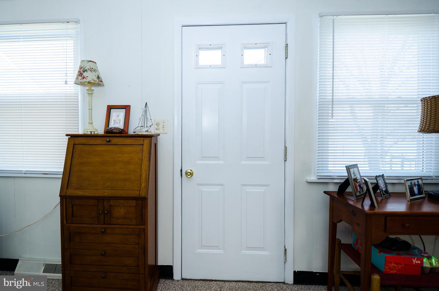 207 Cornfield Road Pasadena, MD 21122 - Photo 22 of 30 This door takes you to the yard, pier and water!