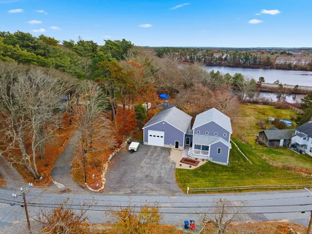 an aerial view of a house with outdoor space