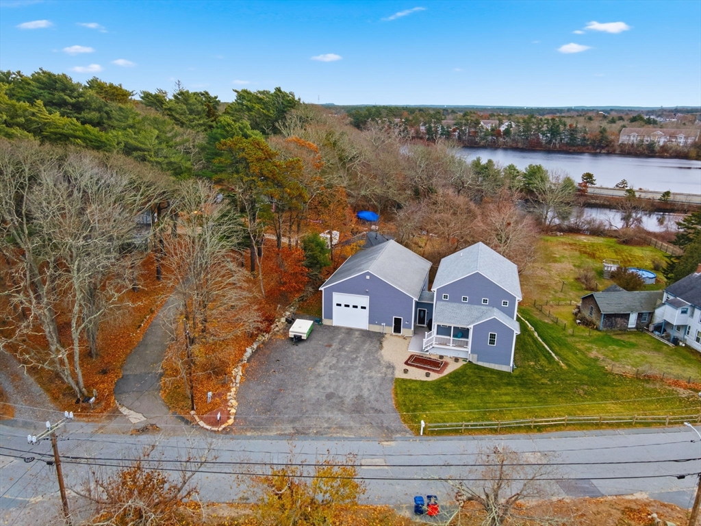 an aerial view of a house with outdoor space