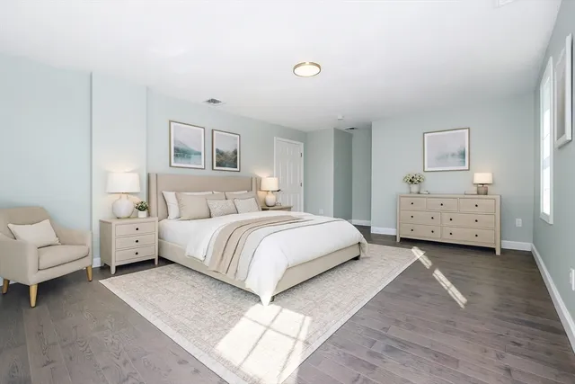 a bedroom with a bed and a couch