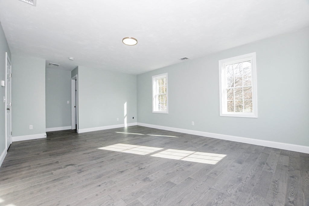 9 Old Glen Charlie Road Wareham, MA 02538 - Photo 21 of 42 an empty room with wooden floor and windows