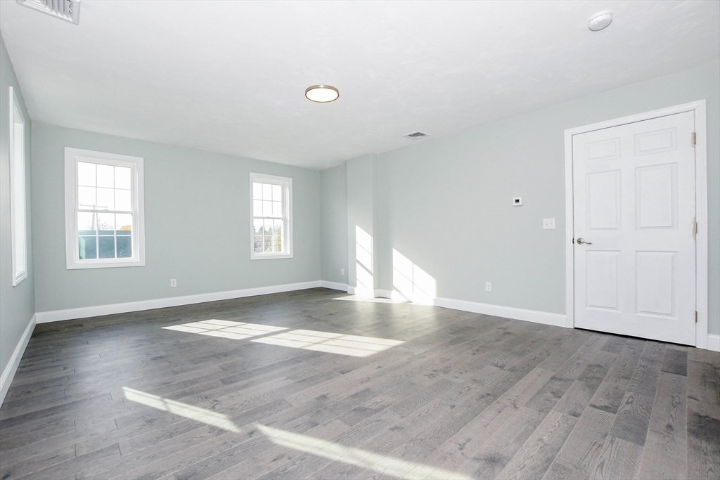 9 Old Glen Charlie Road Wareham, MA 02538 - Photo 24 of 42 an empty room with wooden floor and windows