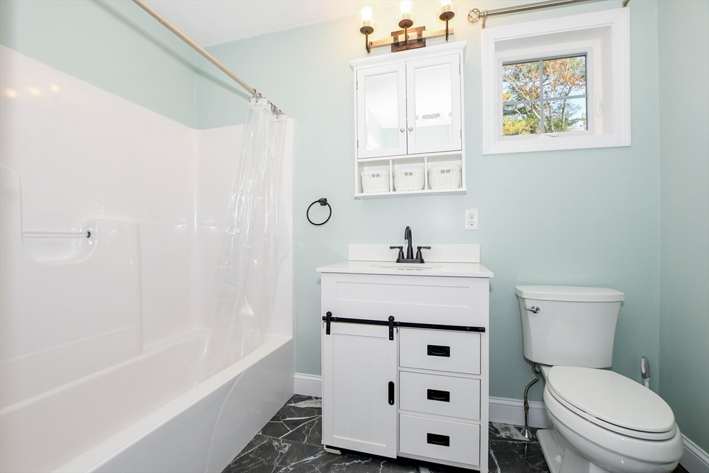 9 Old Glen Charlie Road Wareham, MA 02538 - Photo 26 of 42 a bathroom with a sink mirror toilet and bathtub