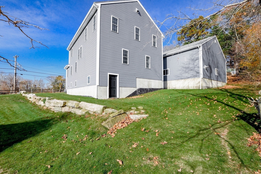 9 Old Glen Charlie Road Wareham, MA 02538 - Photo 6 of 42 a front view of a house with a yard