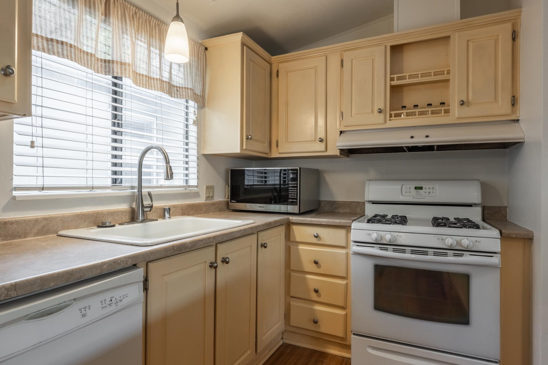 100 Ski Trails Road, Unit 51 Mammoth Lakes, CA 93546 - Photo 11 of 28 a kitchen with granite countertop white cabinets and white appliances