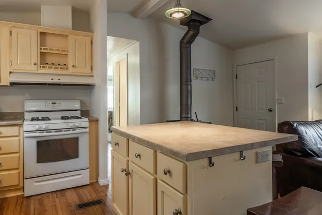 a kitchen with a stove and a sink