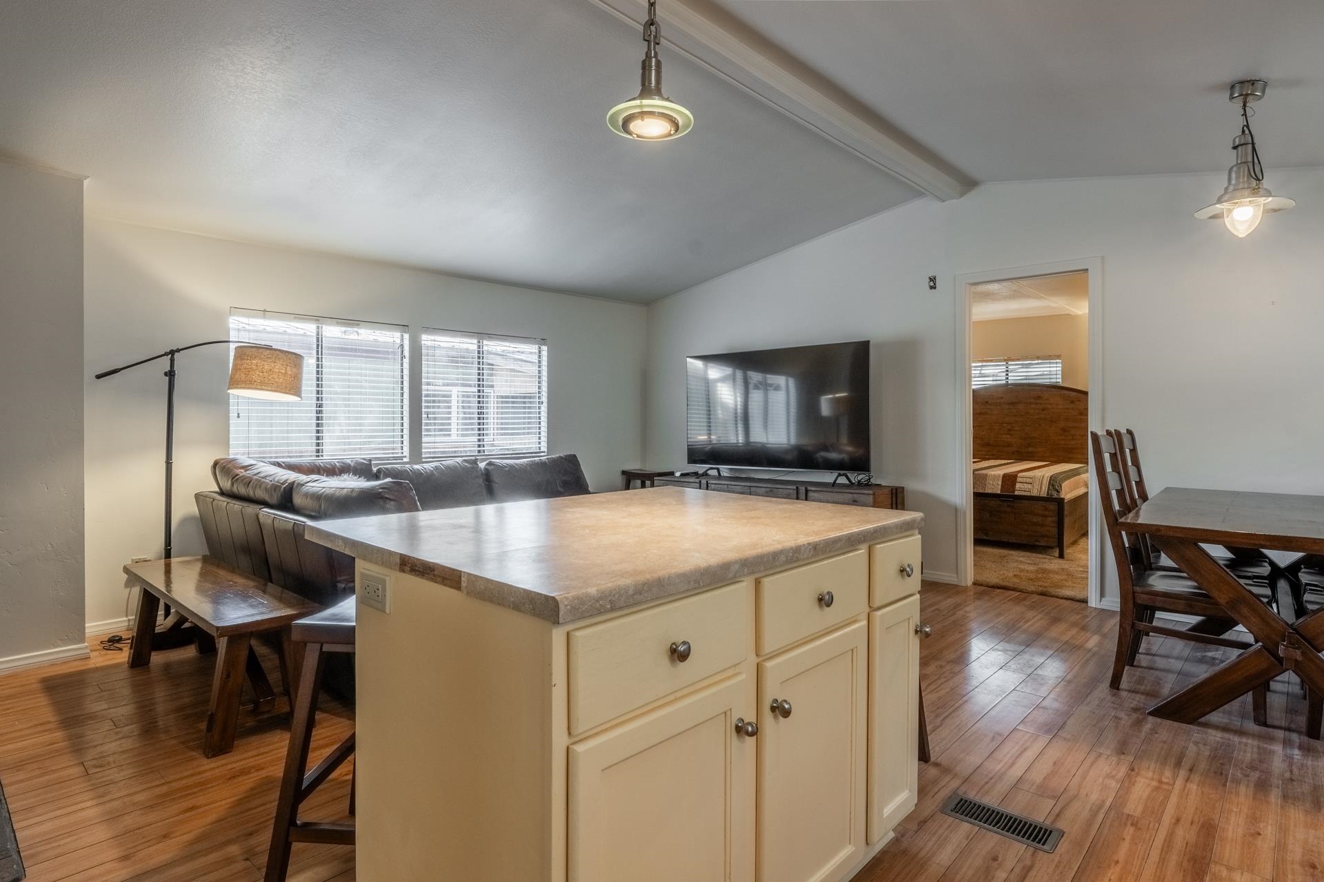 100 Ski Trails Road, Unit 51 Mammoth Lakes, CA 93546 - Photo 28 of 28 a kitchen with a stove a refrigerator a dining table and chairs with wooden floor