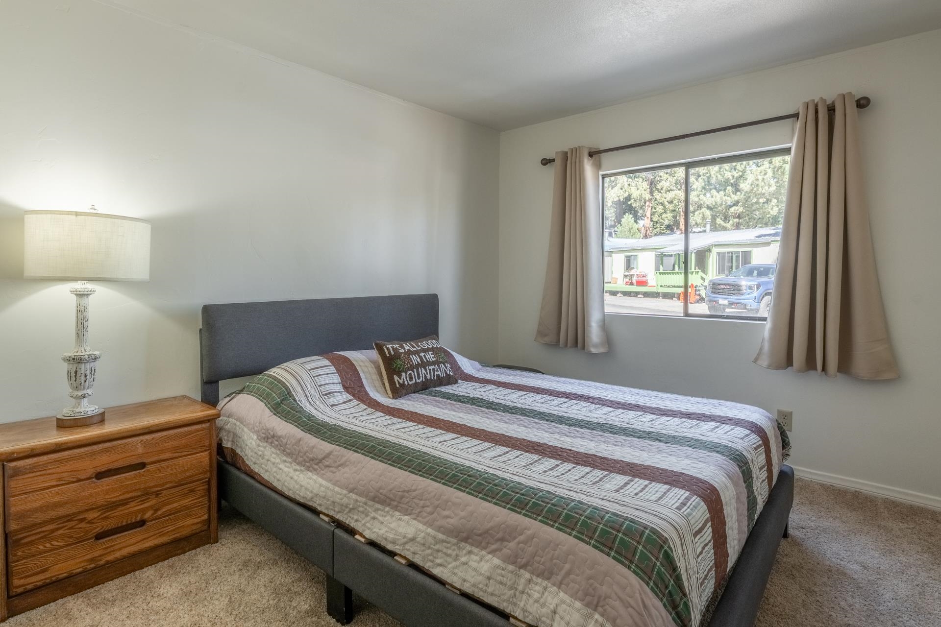 100 Ski Trails Road, Unit 51 Mammoth Lakes, CA 93546 - Photo 13 of 28 a bedroom with a bed and a window