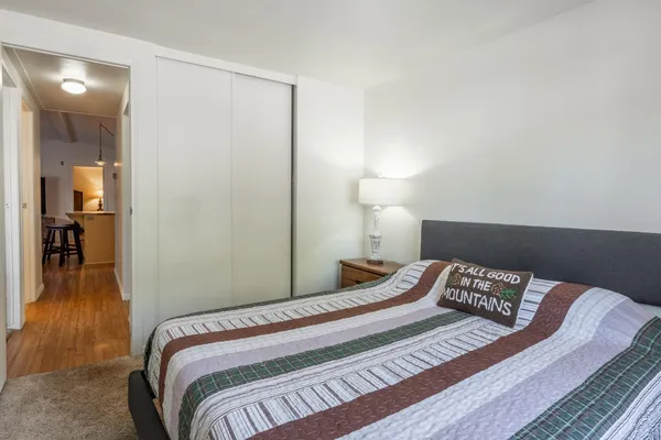 a bedroom with a bed and a window