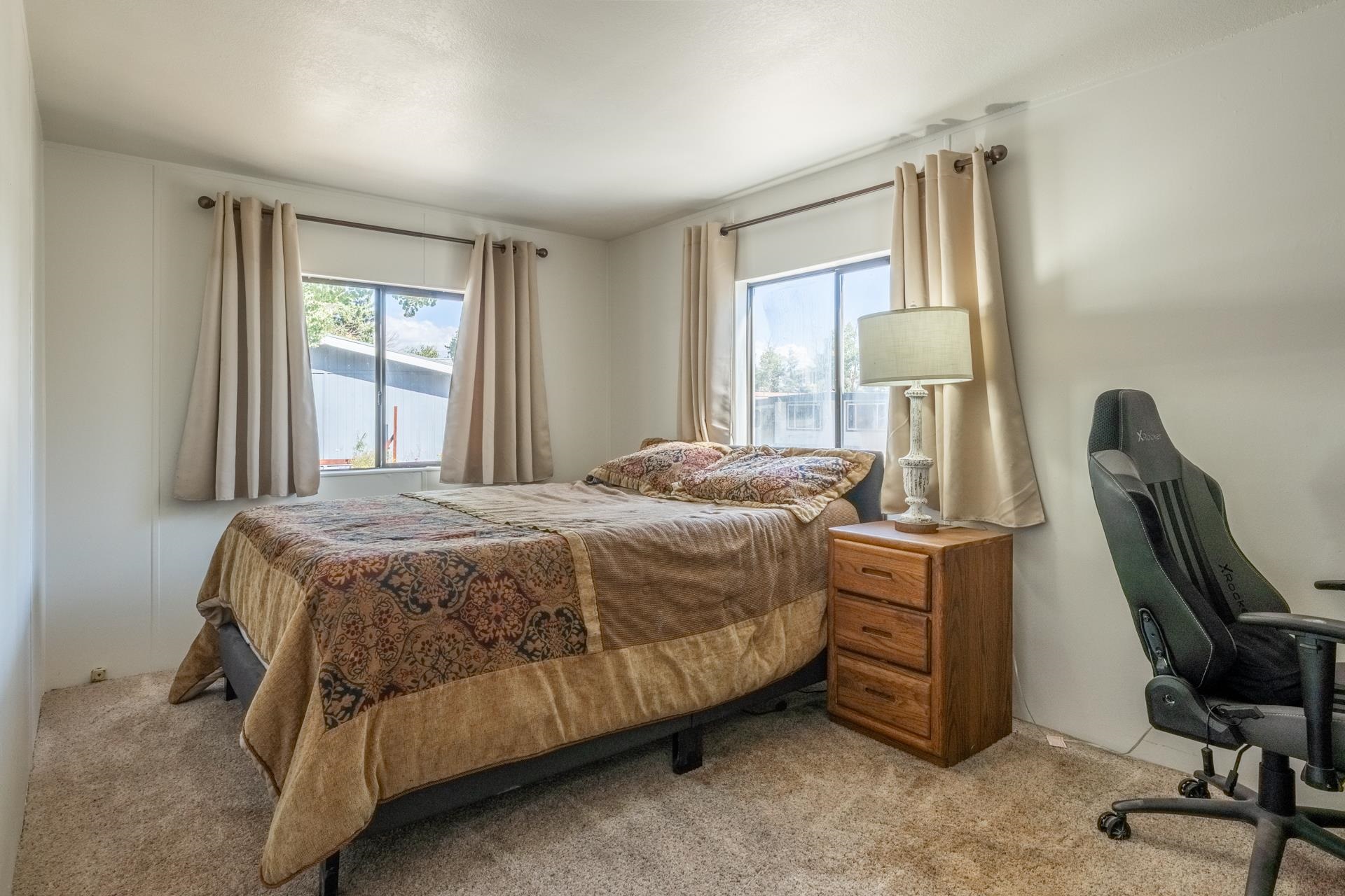 100 Ski Trails Road, Unit 51 Mammoth Lakes, CA 93546 - Photo 15 of 28 a bedroom with a bed a desk and chair