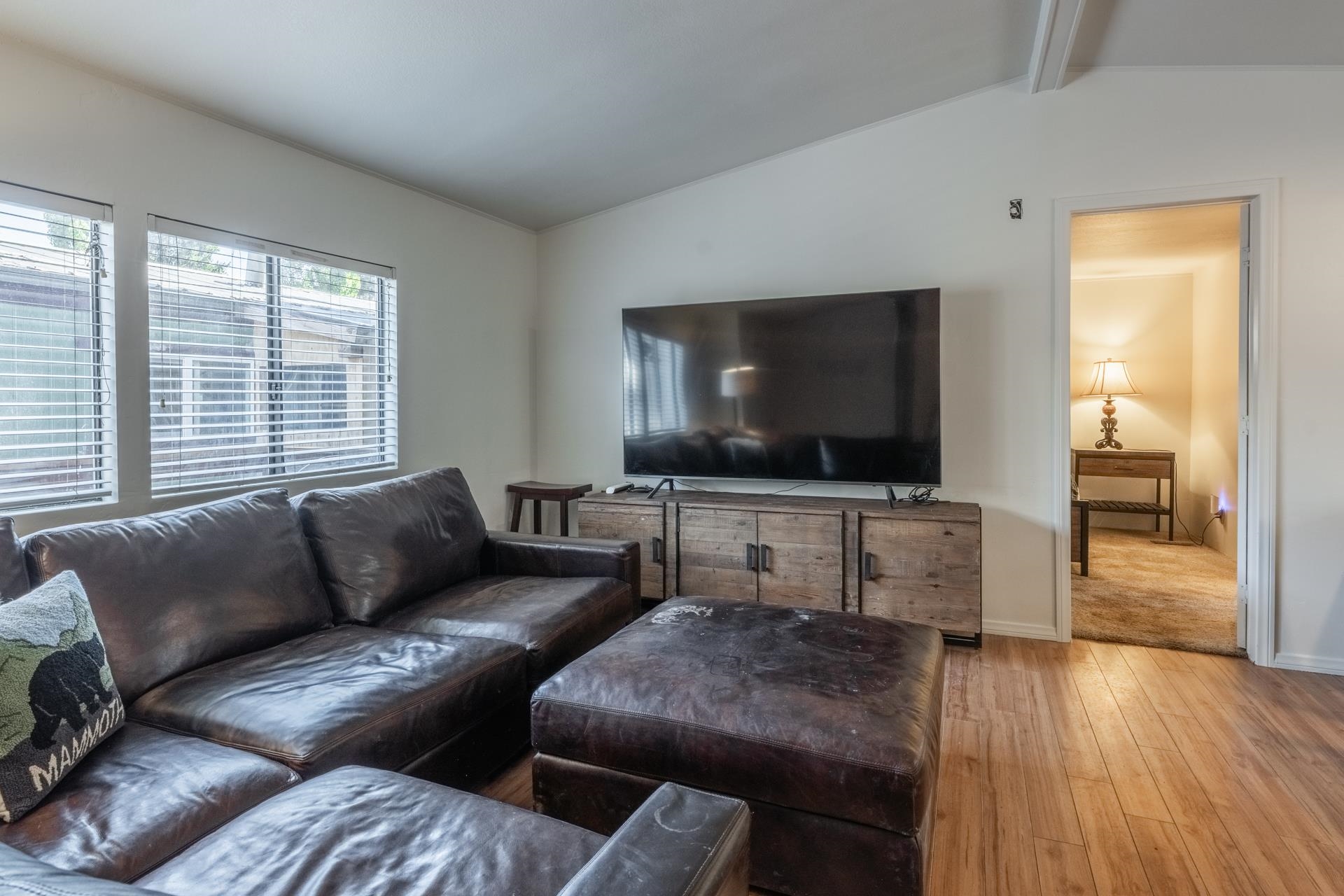 100 Ski Trails Road, Unit 51 Mammoth Lakes, CA 93546 - Photo 7 of 28 a living room with furniture and a flat screen tv