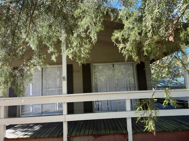 a view of balcony with furniture