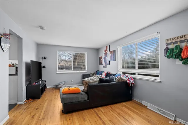 a bedroom with a bed window and couch