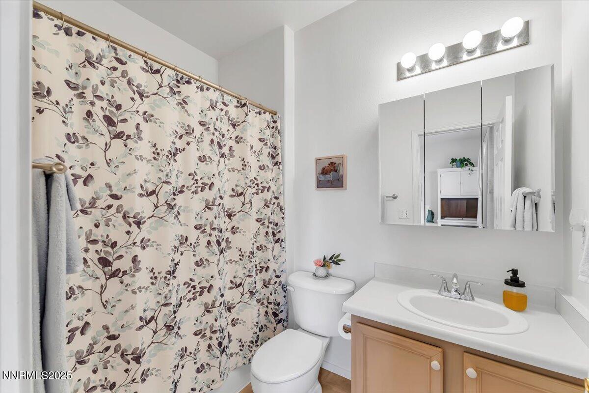 5921 Sapphire Ridge Court Reno, NV 89523 - Photo 17 of 31 a bathroom with a sink toilet and shower