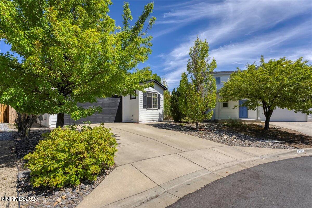 5921 Sapphire Ridge Court Reno, NV 89523 - Photo 2 of 31 a front view of a house with a yard and a garage