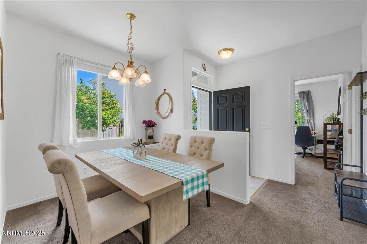 5921 Sapphire Ridge Court Reno, NV 89523 - Photo 5 of 31 a view of a dining room with furniture window and wooden floor