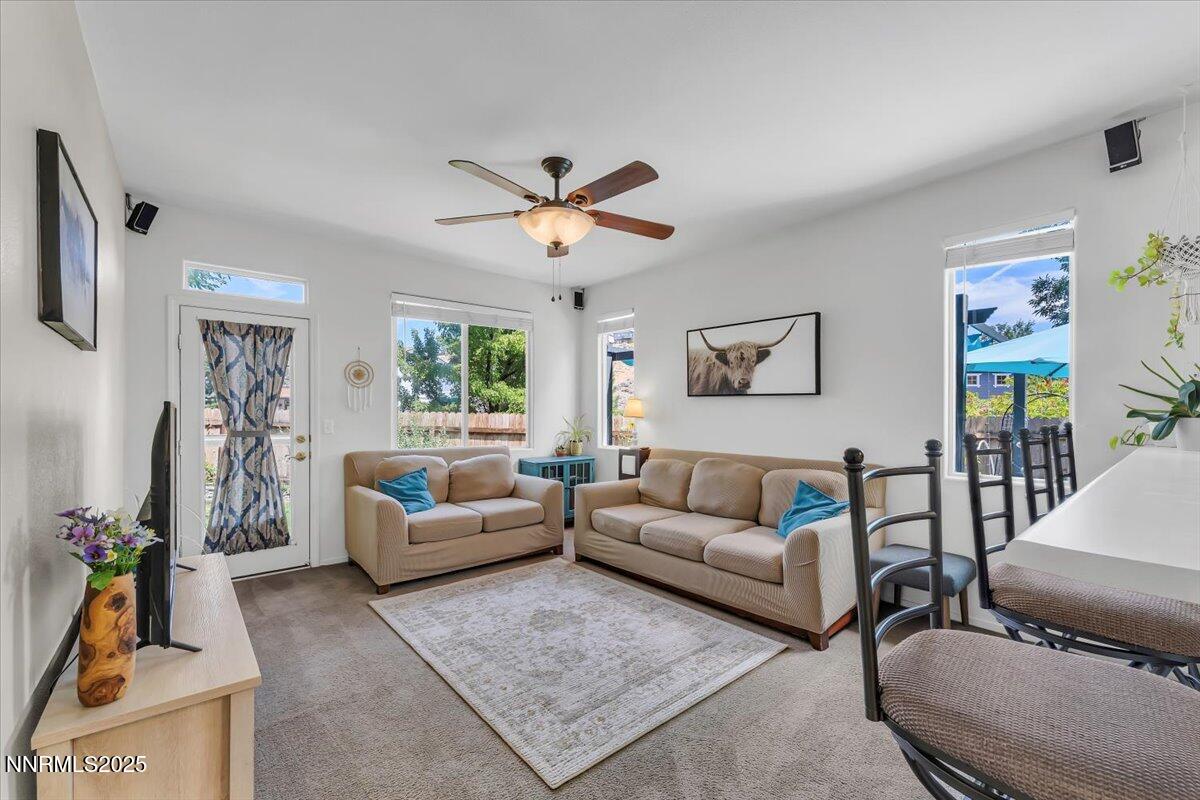 5921 Sapphire Ridge Court Reno, NV 89523 - Photo 7 of 31 a living room with furniture and a flat screen tv
