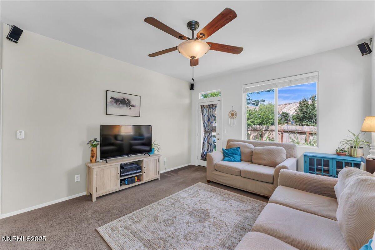 5921 Sapphire Ridge Court Reno, NV 89523 - Photo 8 of 31 a living room with furniture and a flat screen tv