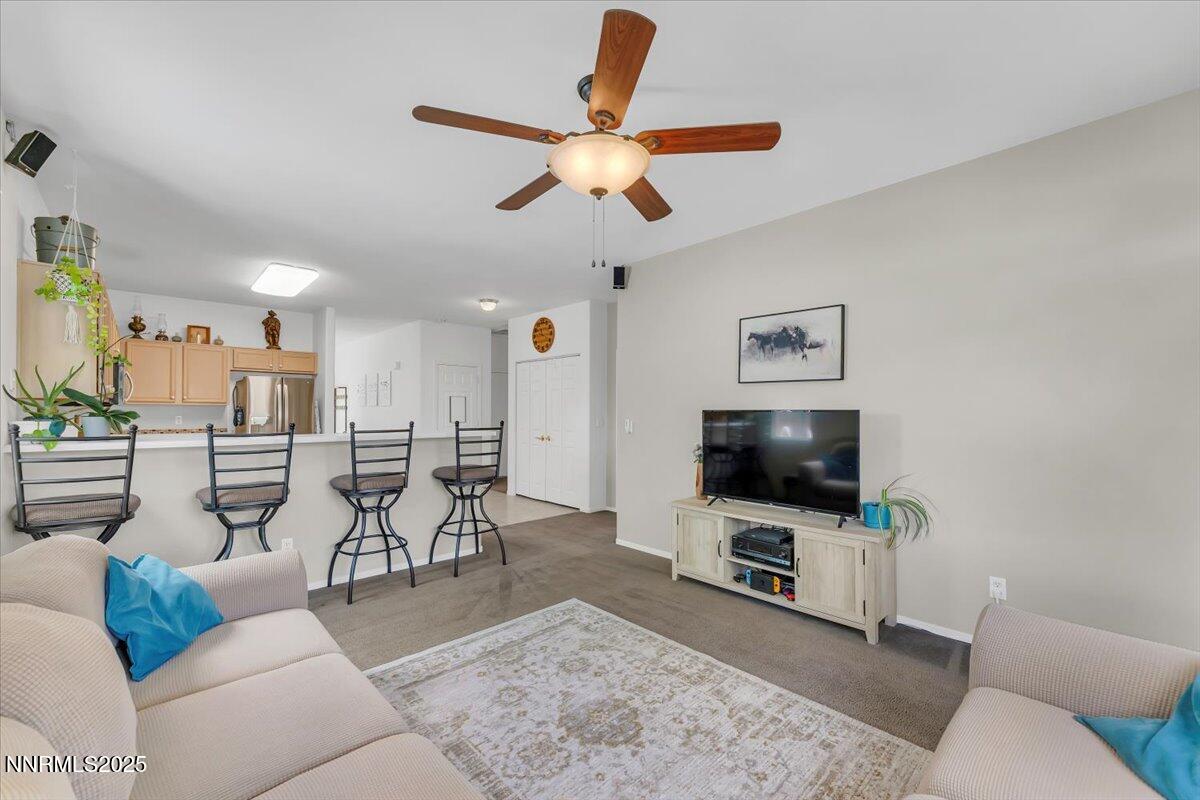 5921 Sapphire Ridge Court Reno, NV 89523 - Photo 9 of 31 a living room with furniture and a flat screen tv