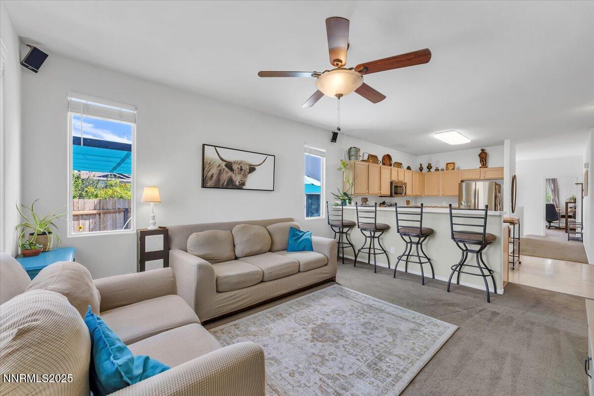 5921 Sapphire Ridge Court Reno, NV 89523 - Photo 10 of 31 a living room with furniture kitchen view and a wooden floor
