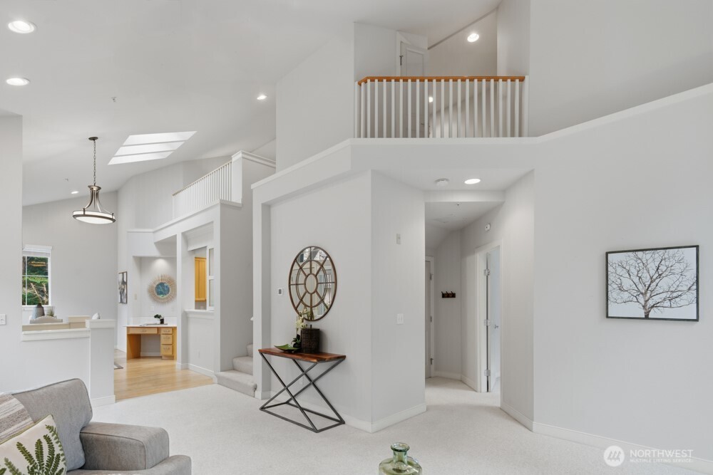 120 Newport Way Northwest, Unit 9 Issaquah, WA 98027 - Photo 14 of 40 a view of entryway with livingroom and furniture