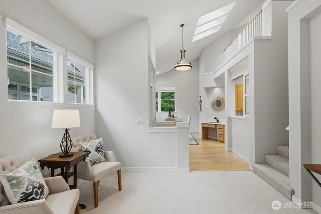 a living room with furniture and entry gate