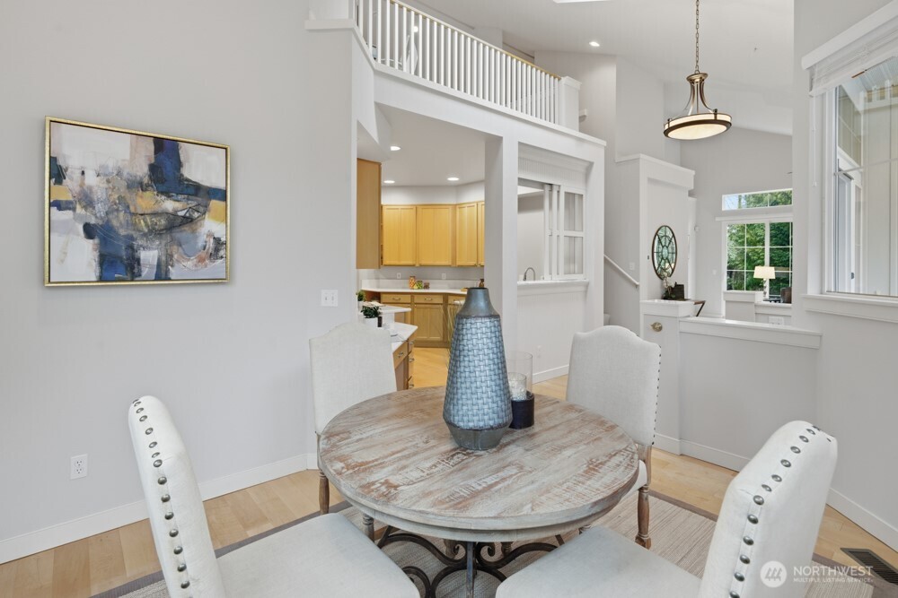 120 Newport Way Northwest, Unit 9 Issaquah, WA 98027 - Photo 17 of 40 a living room with furniture and a wooden floor