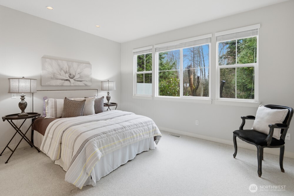 120 Newport Way Northwest, Unit 9 Issaquah, WA 98027 - Photo 23 of 40 a bedroom with a bed and a window