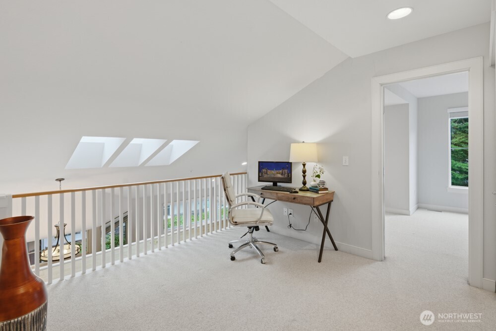 120 Newport Way Northwest, Unit 9 Issaquah, WA 98027 - Photo 28 of 40 a view of a workspace with furniture and a window