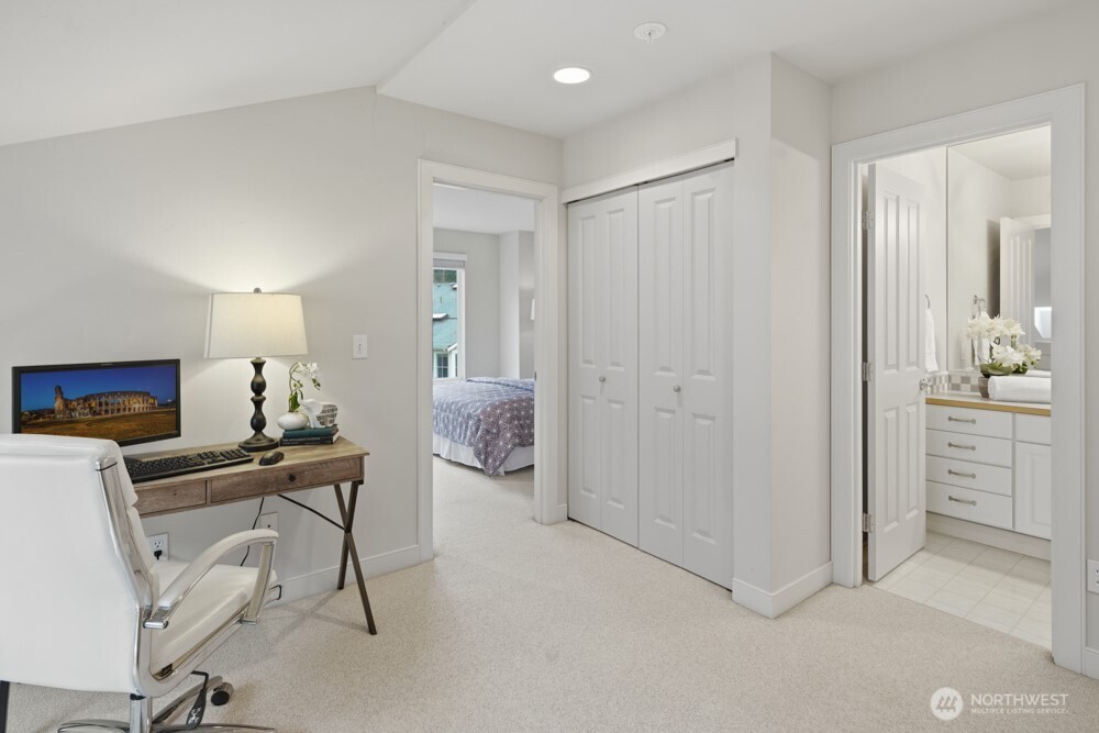 120 Newport Way Northwest, Unit 9 Issaquah, WA 98027 - Photo 29 of 40 a view of a workspace with furniture and a bathroom