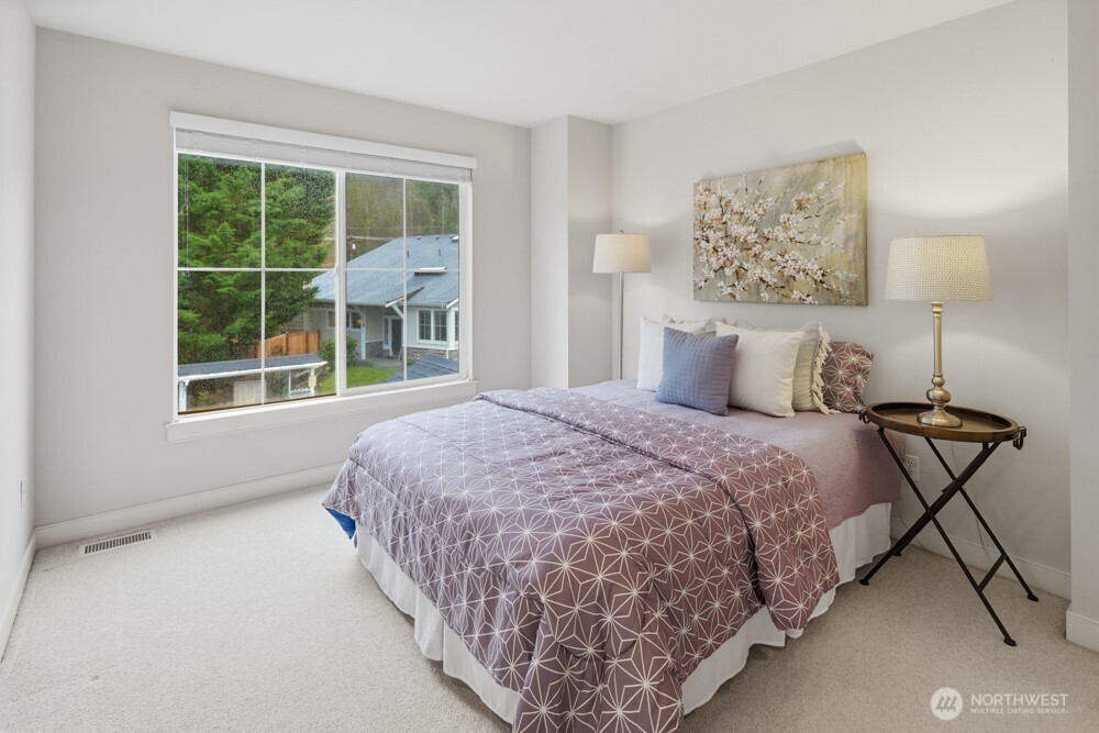 120 Newport Way Northwest, Unit 9 Issaquah, WA 98027 - Photo 31 of 40 a bedroom with bed and a window