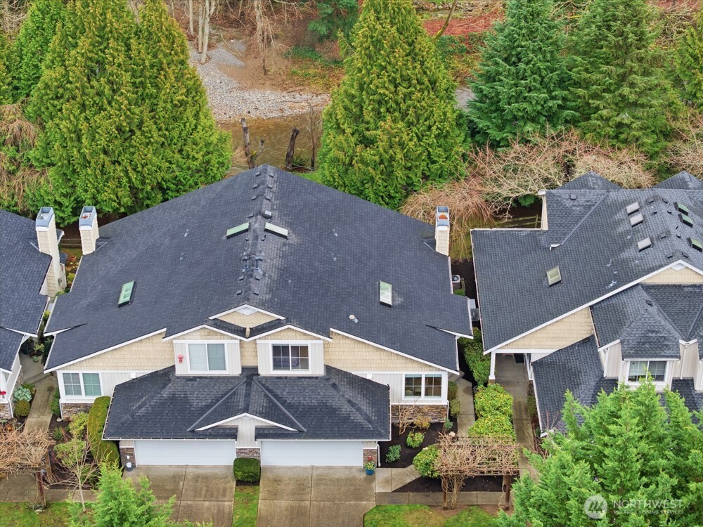 120 Newport Way Northwest, Unit 9 Issaquah, WA 98027 - Photo 37 of 40 an aerial view of a house with a yard