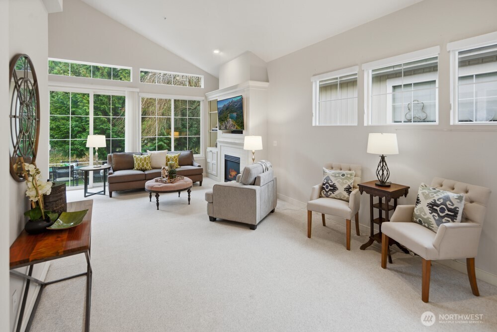 120 Newport Way Northwest, Unit 9 Issaquah, WA 98027 - Photo 5 of 40 a living room with furniture and a large window