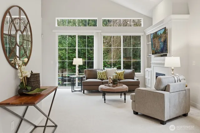 a living room with furniture and a large window