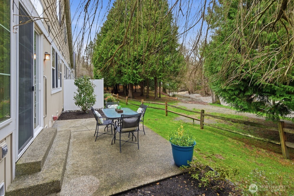 120 Newport Way Northwest, Unit 9 Issaquah, WA 98027 - Photo 10 of 40 a view of a backyard with sitting area and garden