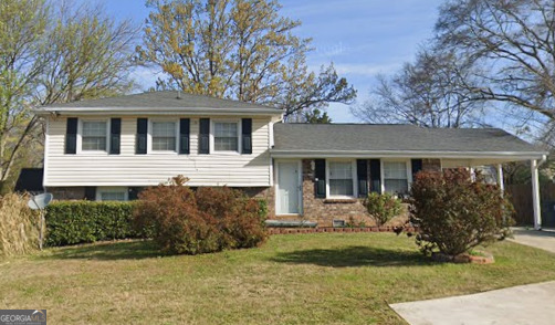 2486 Rex Road Ellenwood, GA 30294 - Photo 1 of 6 a front view of a house with garden