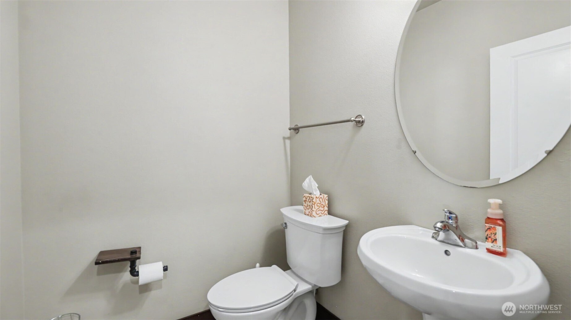 1357 Elma Place Northeast Renton, WA 98059 - Photo 14 of 40 a white toilet sitting next to a bathroom sink