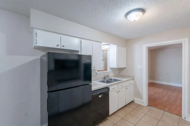 a kitchen with a stove and a refrigerator
