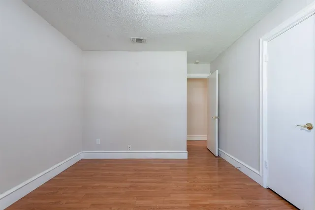a view of a backyard with plants and garden