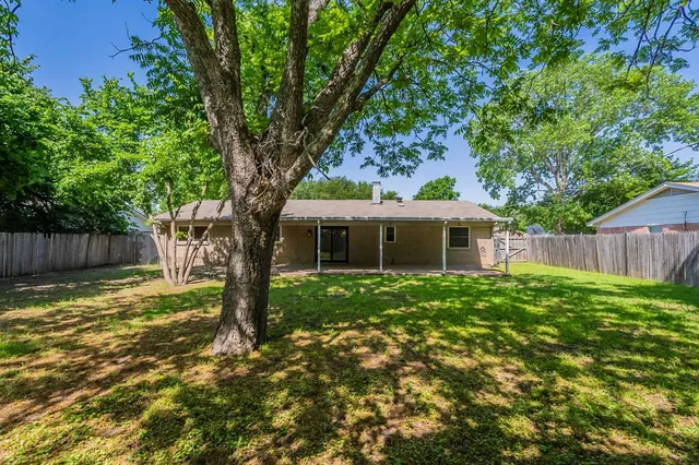 a backyard of a house with seating space