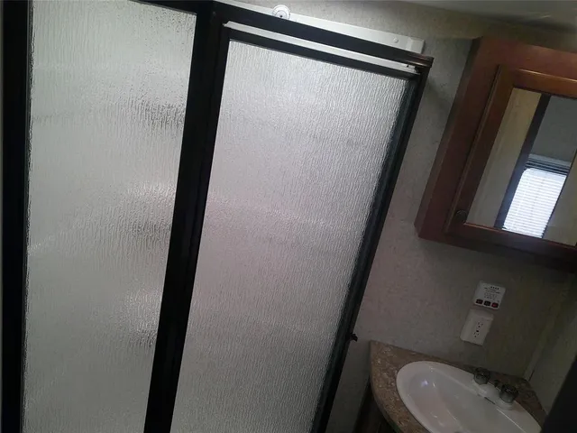 a bathroom with a sink and toilet