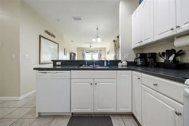 a kitchen with cabinets and window
