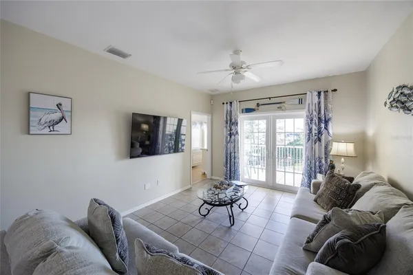 a living room with furniture and a large window