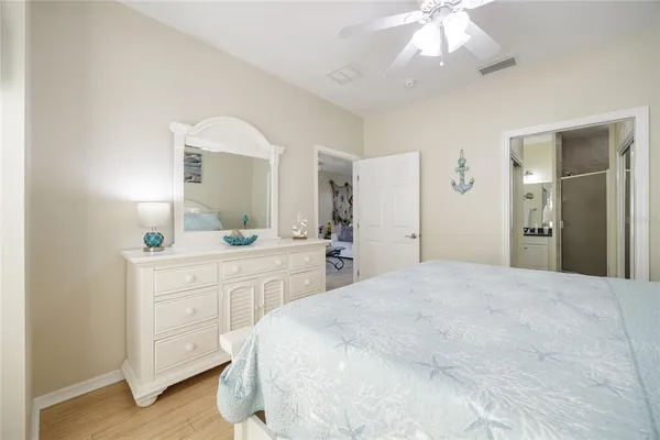 a bathroom with a glass door shower and a sink