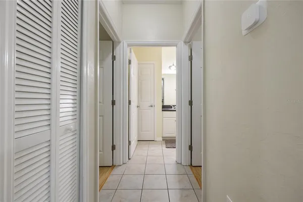 a bedroom with a bed and a television