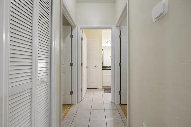 a bedroom with a bed and a television